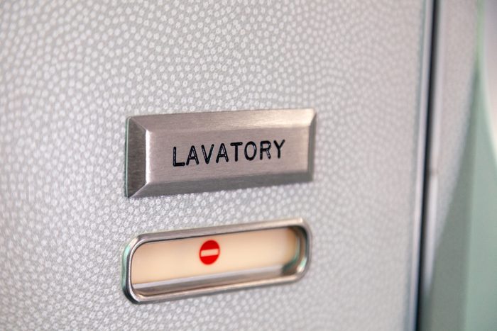 bathroom sign on an airplane