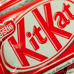 A KitKat wrapper displays bold red and white branding with 