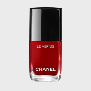 Red nail polish in a rectangular bottle; black cap features 