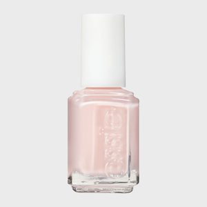 A bottle of pale pink nail polish stands upright, featuring a white cap, against a plain background. The text 