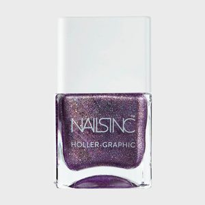 Nail polish bottle, showing shimmering purple contents, labeled 