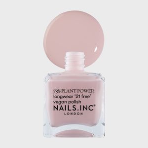 Nail polish bottle displaying light pink polish on white background, labeled: 73% plant power, longwear â€˜21 free,â€™ vegan polish, Nails Inc. London.