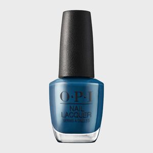 A blue nail polish bottle stands upright against a plain background. Text reads 