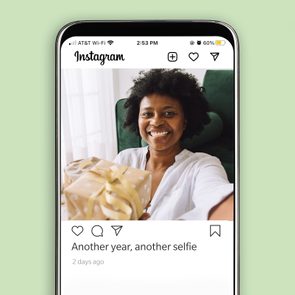 Person smiling holds a wrapped gift, capturing a selfie in a chair. Instagram interface displays 