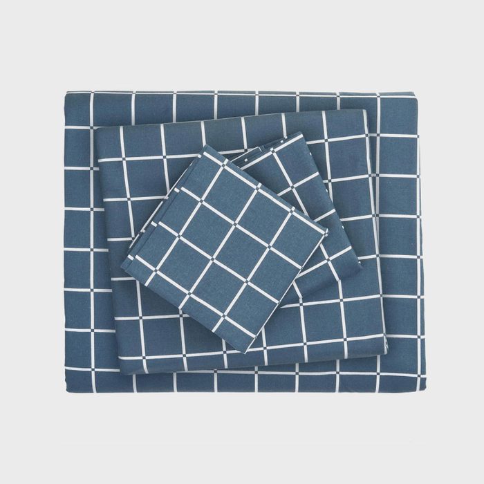 Stacked blue checkered fabric set with a white grid pattern, neatly arranged on a plain white background.