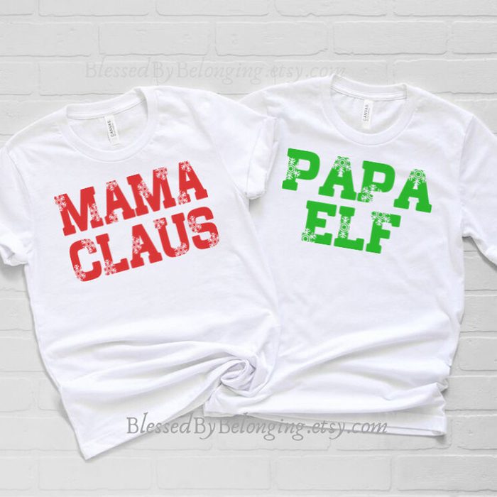 Two white T-shirts display festive text: 