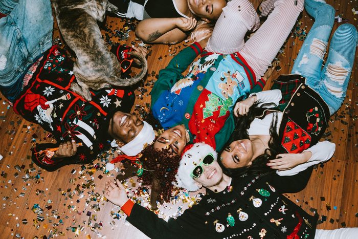 group of friends at a ugly sweater christmas party