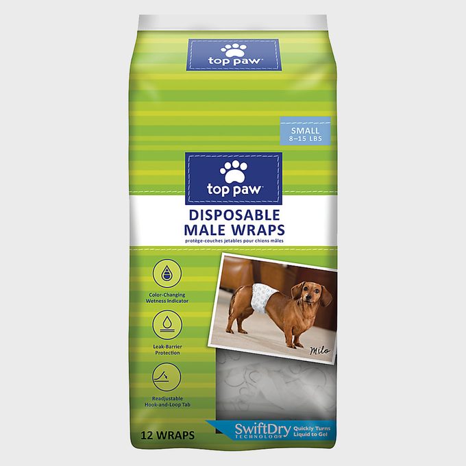 Packaging displays a dachshund wearing a disposable male wrap, with features including color-changing wetness indicator, leak-barrier protection, and SwiftDry technology.