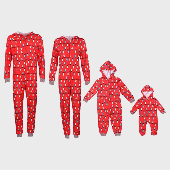 Red onesies with hood, featuring Christmas light pattern, arranged in increasing size order against a plain background.