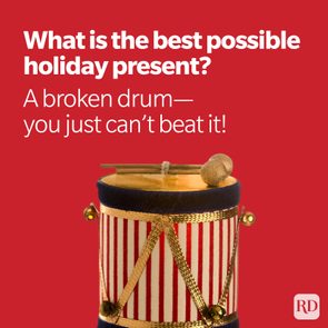 Drum sits still against a red background, accompanied by humorous holiday-themed text: 