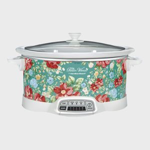 A floral-patterned slow cooker displaying settings labeled 