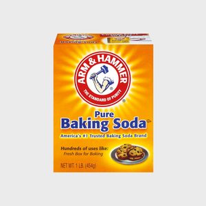 Box of baking soda, displays brand logo and product information, with cookies pictured, set against a bright, yellow background.