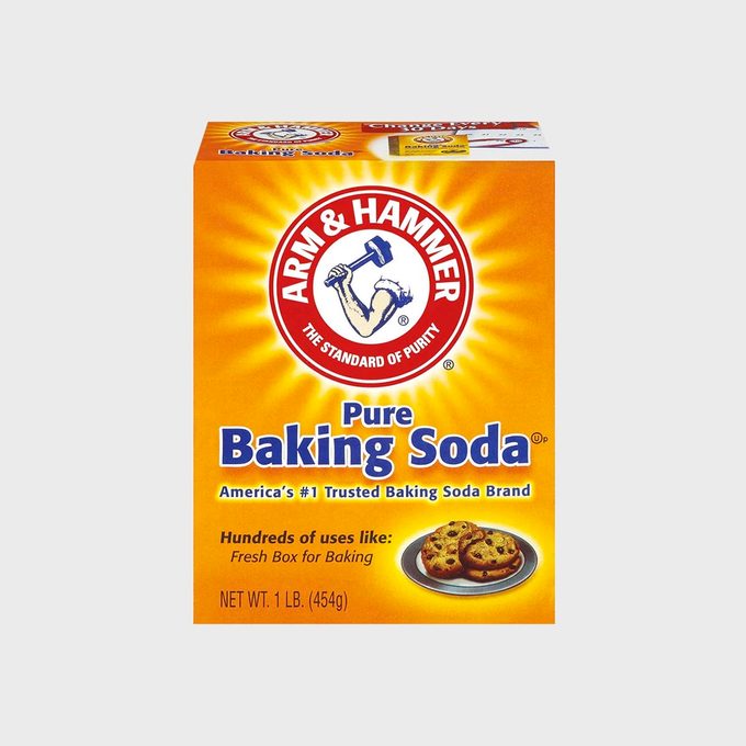 Box of baking soda, displays brand logo and product information, with cookies pictured, set against a bright, yellow background.