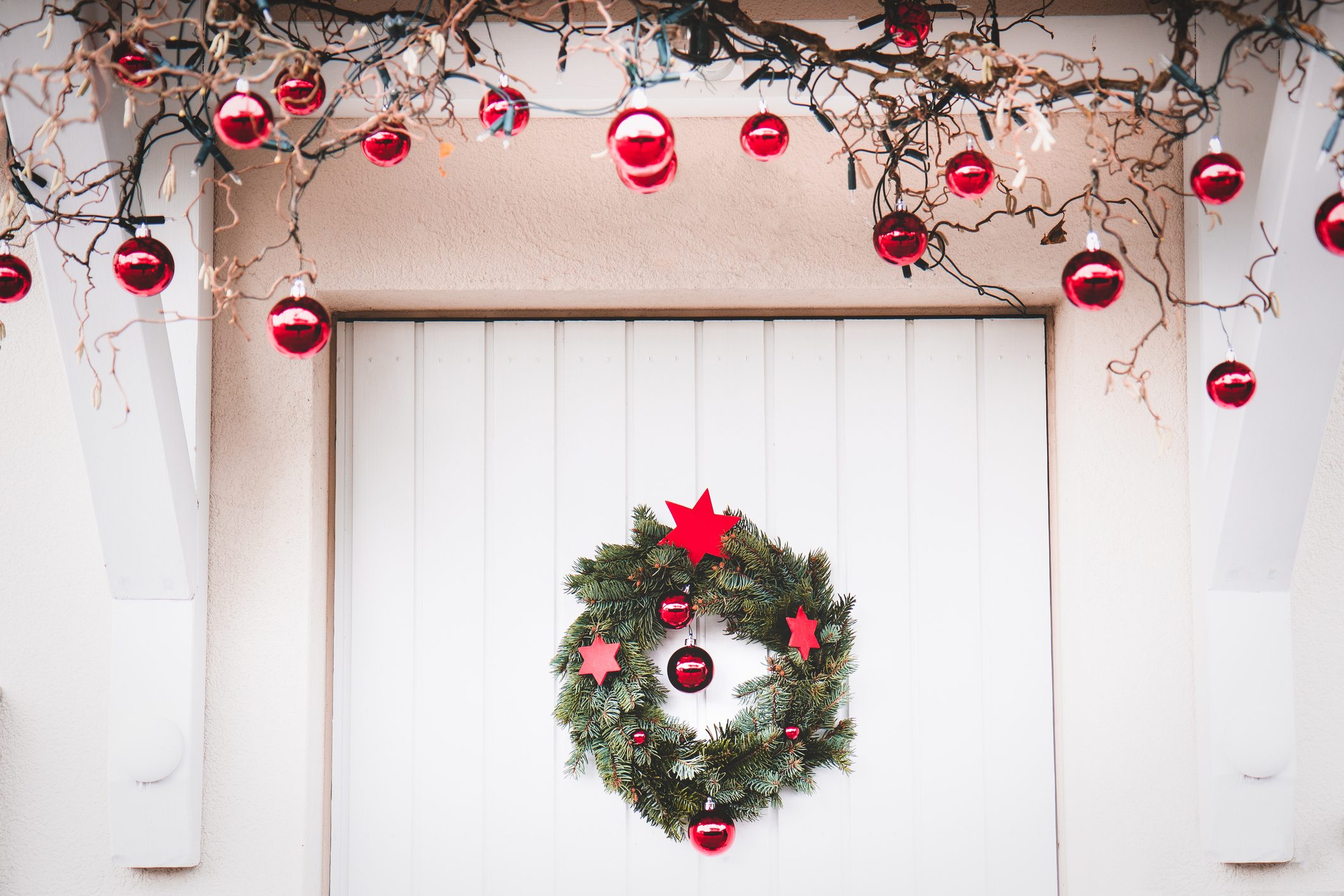 Christmas entrance door decoration white and red with christmas wreath