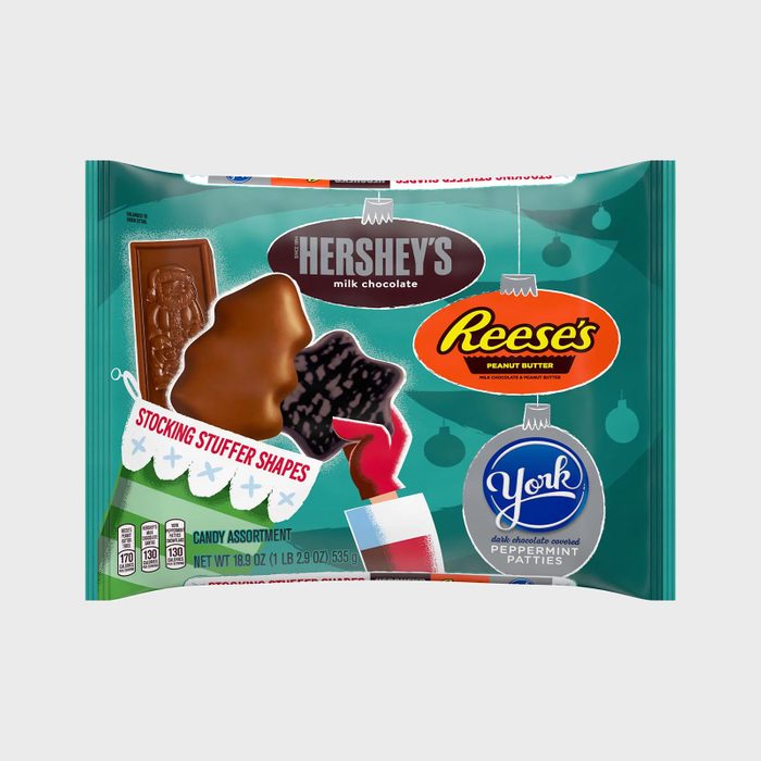 Candy package displays assorted chocolates; Hershey's, Reese's, York shapes for stocking stuffers, with festive designs on green background. Weight: 18.9 oz (535 g).