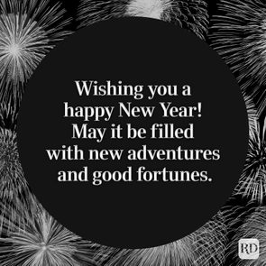 Text in circular frame wishes a happy New Year, surrounded by fireworks on a dark background.