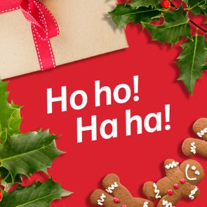 Gift box with red ribbon, surrounded by holly and gingerbread men on red background; text reads 