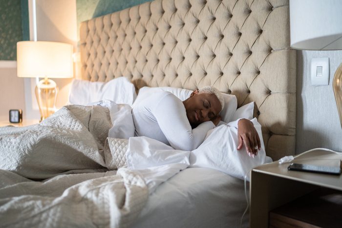 Woman sleeping on the bed at home