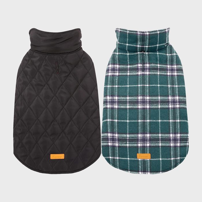 Two dog coats displayed side by side; one black quilted, one green plaid, both