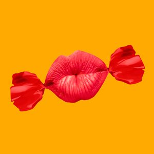 Bright red lips wrapped like candy, floating against a solid yellow background.