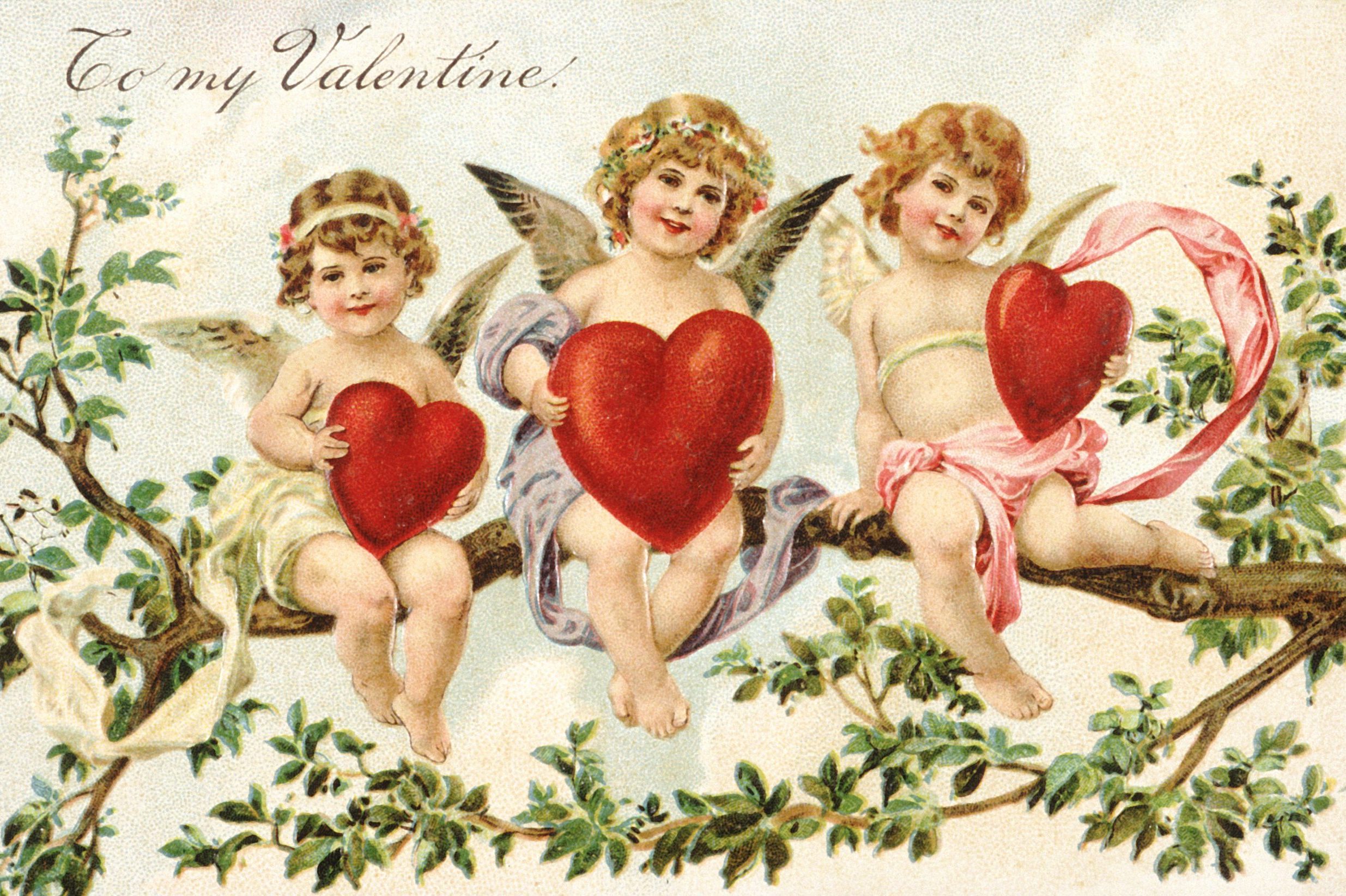 vintage valentine's day card with three cupids