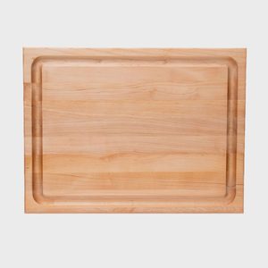 Rectangular wooden cutting board with a groove around its perimeter, resting against a plain white background.