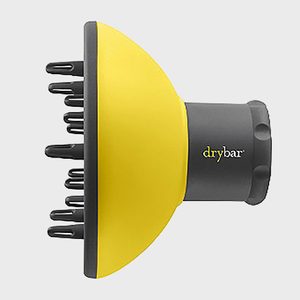 Yellow hairdryer attachment with black prongs, labeled 