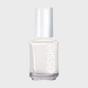 A white nail polish bottle stands upright with 