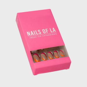 Box contains press-on nail extensions; pink packaging with window display reveals nails inside; labeled 