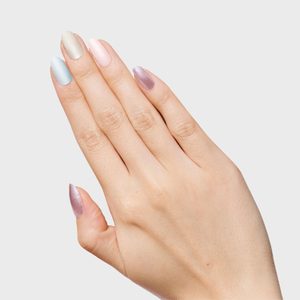 A hand displays multicolored nails, including blue, beige, pink, and lilac, against a plain white background.