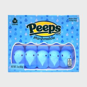 Box of blue marshmallow chicks sits inside packaging with spotted design and text stating 