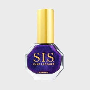 Nail polish bottle with gold cap holds shimmering purple lacquer, labeled 