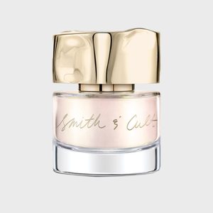 Polished nail polish bottle with gold cap, inscribed with 