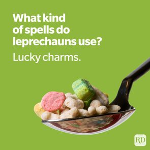 Spoon holds colorful cereal marshmallows on a green background. Text reads, 