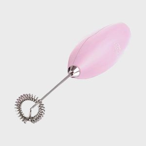 A pink handheld milk frother with a silver whisk attached, set against a plain white background.