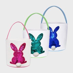 Bags display sequin bunnies with fluffy tails; vibrant handles in pink, green, blue. Bright, decorative, white background enhances festive appeal.