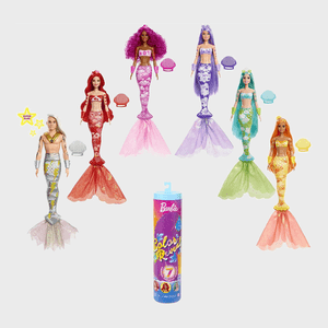 Mermaid-themed dolls stand with colorful tails, posed upright. A bright packaging tube labeled 