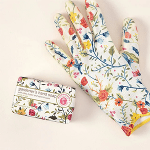 Floral-patterned glove rests beside box labeled 
