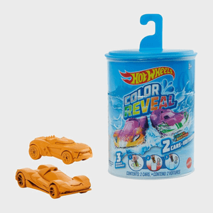 Two orange toy cars are positioned beside a blue cylindrical package labeled 