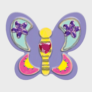 Purple butterfly-shaped decoration, adorned with colorful gemstones and glitter, displayed on a plain white background.
