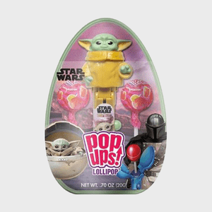 Plastic character dispenses lollipops, surrounded by colorful candy and themed artwork, within a clear, egg-shaped package labeled 