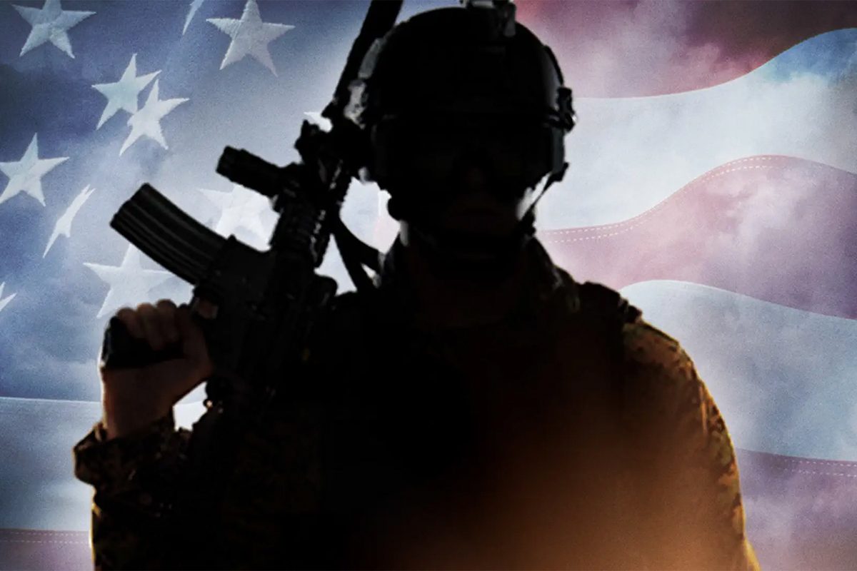A silhouetted soldier holds a rifle against an American flag backdrop with stars and stripes.