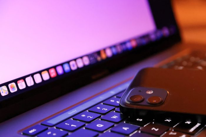 In this photo illustration, Apples iPhone 12 seen placed...