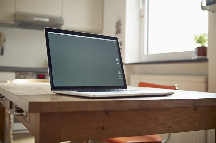 Laptop on kitchen table