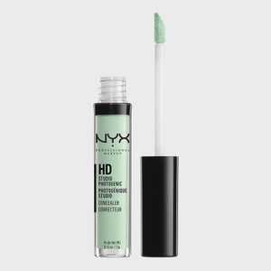 Green concealer in a transparent tube with applicator, labeled 