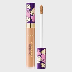Concealer with floral-patterned cap, open with wand alongside; text reads 