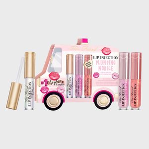 Lip glosses stand in a pink cardboard truck, labeled 