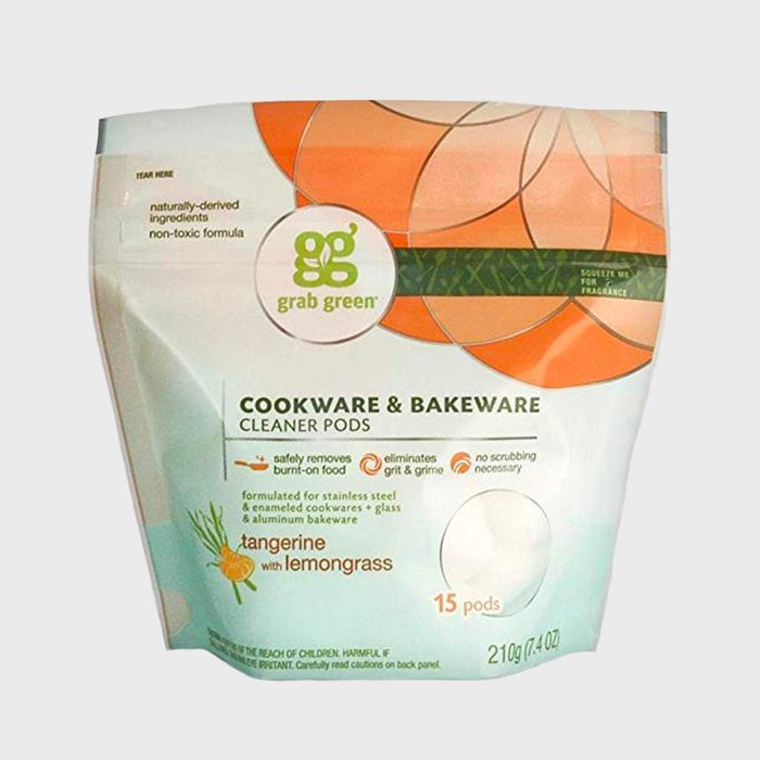 A package contains cleaner pods with tangerine lemongrass scent for cookware, promoting non-toxic cleaning without scrubbing. Contains 15 pods, 210g total.