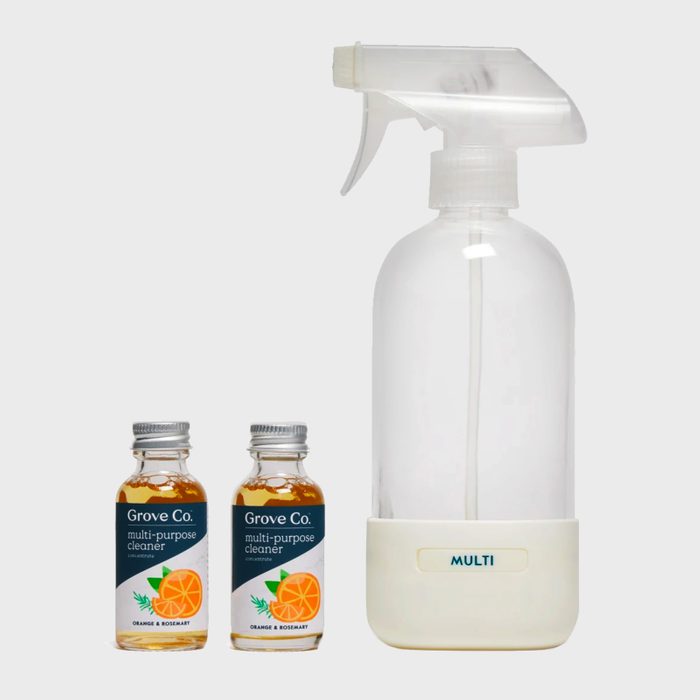 Spray bottle and two cleaner bottles displayed on a light background. Cleaner bottles labeled 