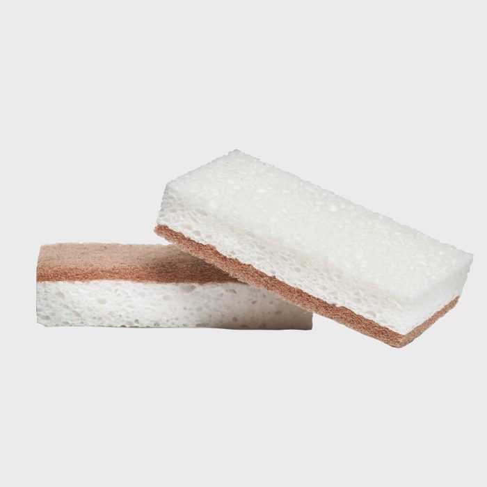 Two rectangular sponges stacked, one lying flat, displaying white and brown layers, set against a plain background.
